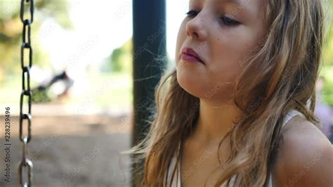 Close up of blonde girl as she listens to playground conversation Stock ビデオ Adobe Stock