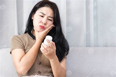 Unhappy Asian Woman Suffering From Toothache Sore Swollen And