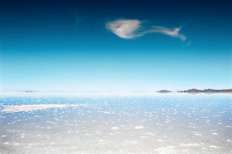 Premium Photo White Salt Surface With Water In Salar De Uyuni Salt