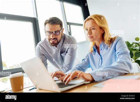 Attentive Blonde Showing Her Plan Stock Photo Alamy