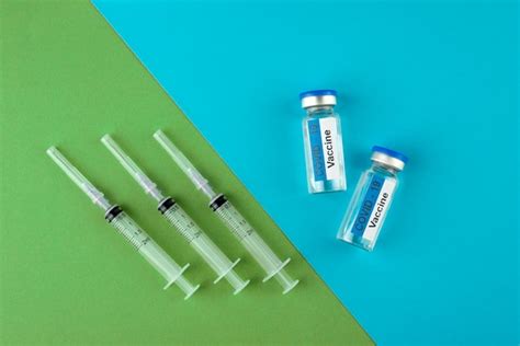 Premium Photo Top View Syringes And Vials Arrangement