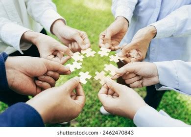 Group Business People Assembling Jigsaw Puzzle Stock Photo