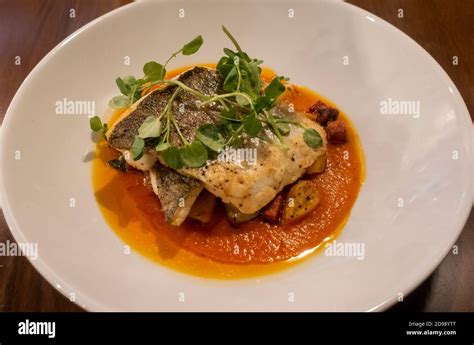 Pan Fried Sea Bass Tomato Sauce Chorizo Parmentier And Potatoes