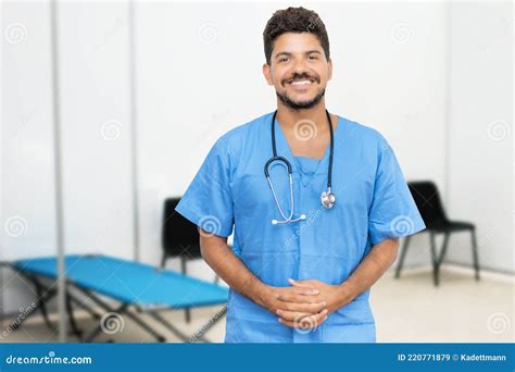 Attractive Mexican Male Doctor Is Ready For Vaccinating Patients Stock