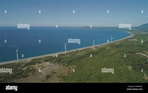 Aerial view of Windmills for electric power production on the seashore ...