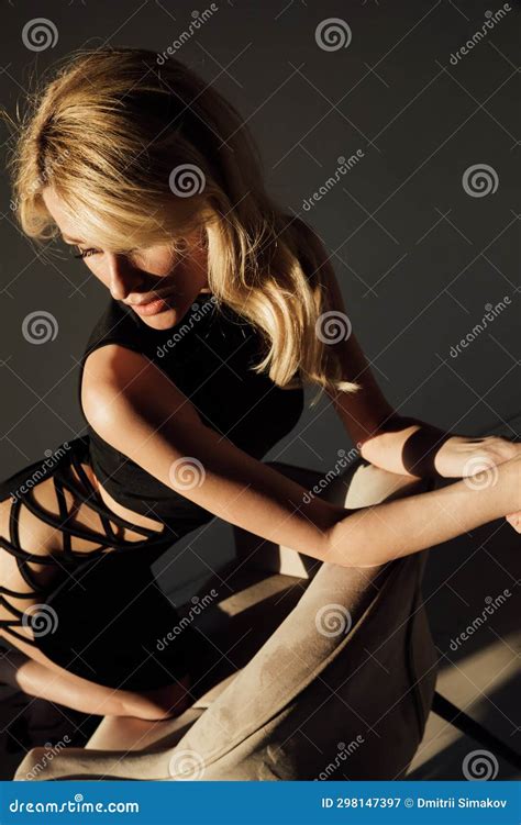 Beautiful Slender Blonde Woman In Black Evening Dress Stock Image