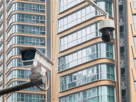 Premium Photo Modern Cctv Camera Hanging Over Modern Residential Building