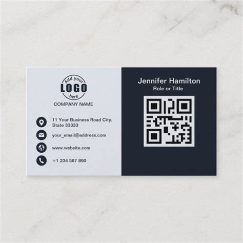 A White And Black Business Card With A Qr Code On The Front Sitting On