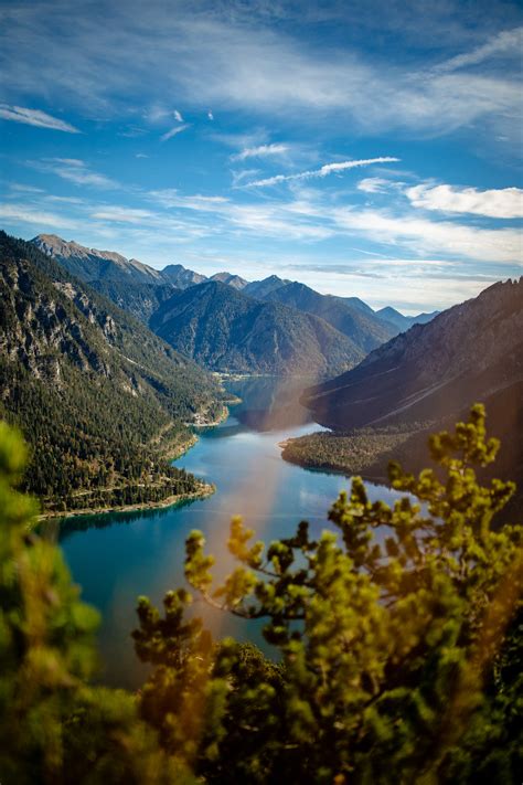 Man by the River in a Mountain Valley · Free Stock Photo