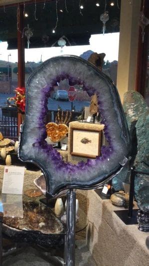 Amethyst Geode Slice On A Rotating Custom Made Stand By The Metal