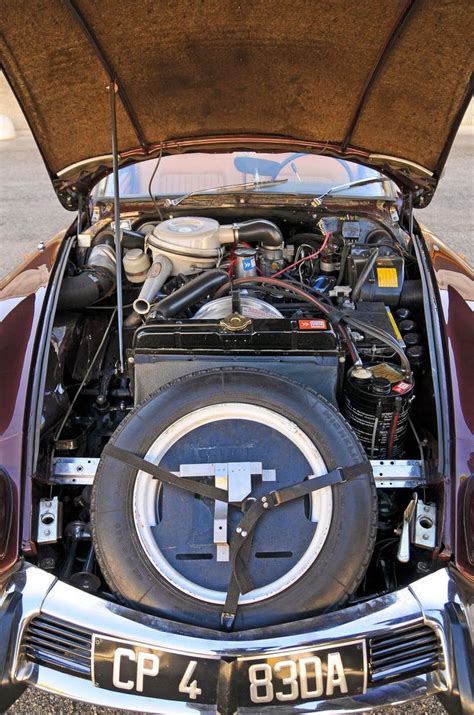 The Engine Compartment Of An Old Car With It S Hood Open