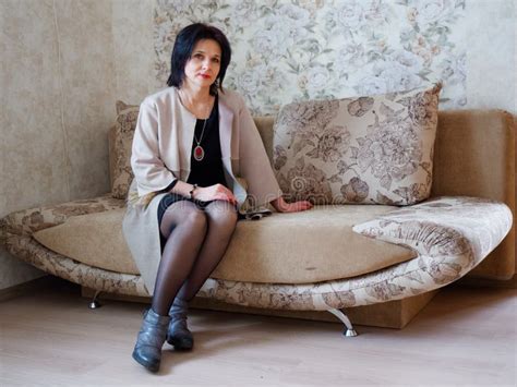 Girl Brunette Portrait Sitting On The Couch Stock Image Image Of Interior Caucasian