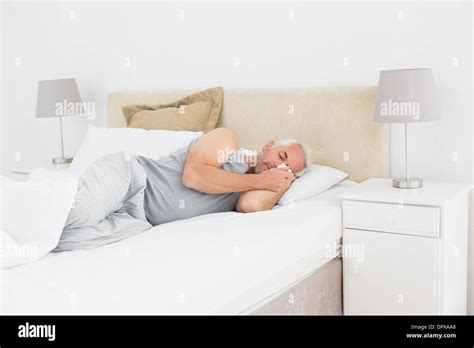 Mature Man Sleeping In Bed Stock Photo Alamy