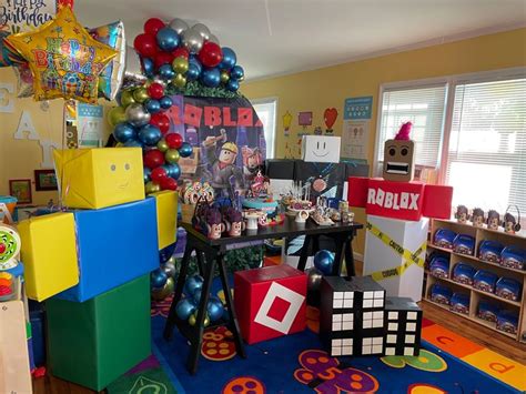 A Room Filled With Lots Of Colorful Balloons And Decorations On The