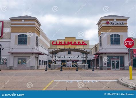 Empty Parking Lot in Front of a Cinemark Movie Theater and an Applebee`s Restaurant during the ...