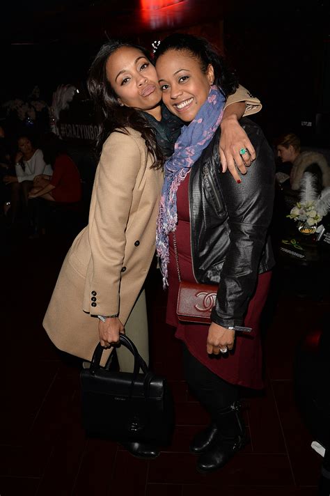 Zoe Saldana planted a kiss on her sister Mariel Saldana. | Beyoncés LA