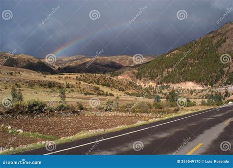 Road in the Peruvian Andes during a Summer Day with Rainbow. Rainy Sky ...