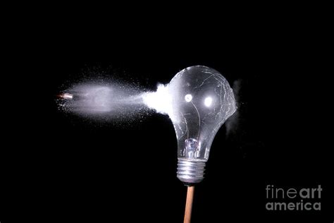 Bullet Hitting A Clear Lightbulb Photograph By Ted Kinsman Fine Art