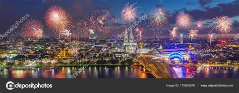 Fireworks at Cologne Skyline with Cathedral and Hohenzollern Bri ...