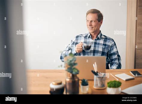 Handsome Mature Man Sitting In Front Of Computer Stock Photo Alamy