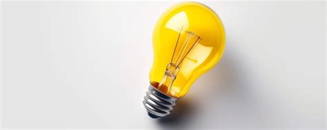 Premium Ai Image A Light Bulb Is On A White Surface