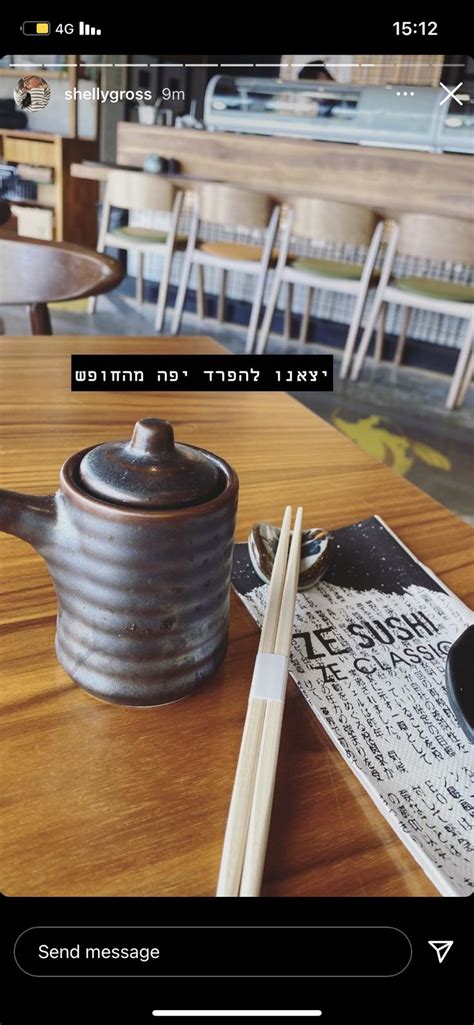 A Teapot And Chopsticks Sitting On A Wooden Table