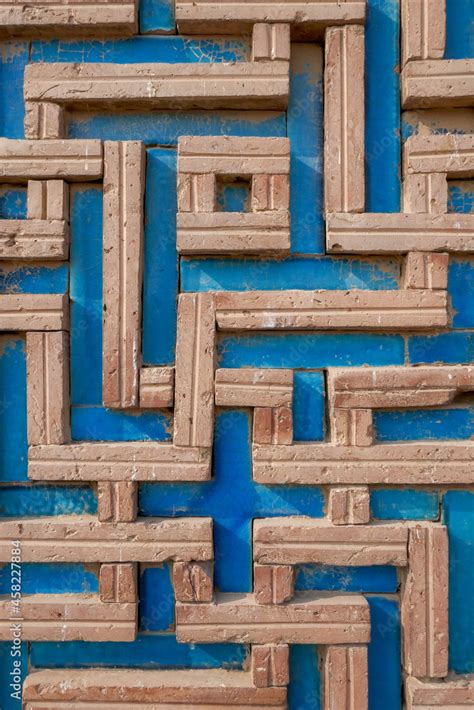 Beautiful Brick And Blue Ceramic Tile Design With Swastika Pattern On