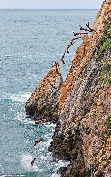 Incredible Pictures Show Death Defying Cliff Divers Leaping 100ft Off A