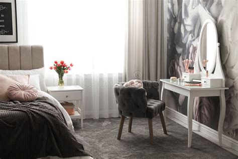 Bedroom Interior With Elegant Dressing Table And Floral Wallpaper Stock