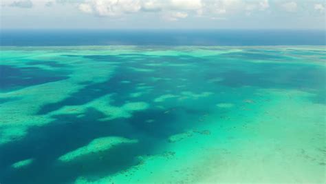 Breathtaking Aerial Panning Right View Of Coral Barrier Reef In Crystal