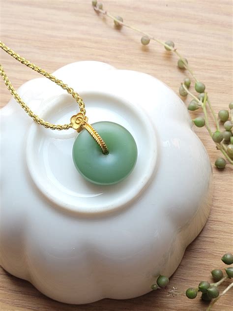 Rare Powder Green Hetian Jade Donut Peace Pendant Set In K Gold