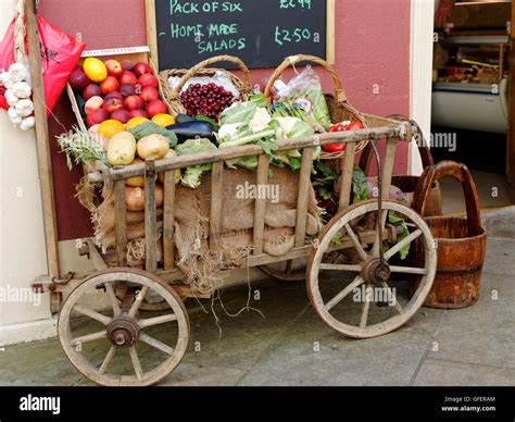 Fruit And Vegetables Displayed In An Old Wooden Hand Cart Outside A