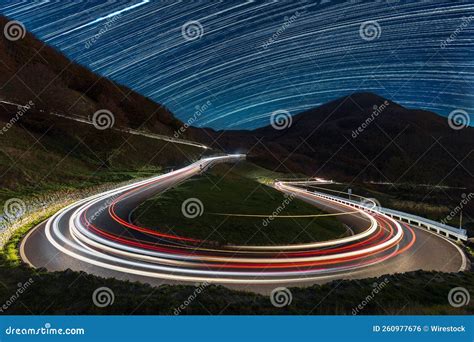 Long Exposure of Light Trails Along a Mountain Road Captured at ...