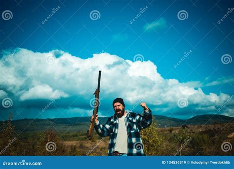 Poacher with Rifle Spotting Some Deers. Illegal Hunting Poacher in the Forest. Stock Image ...