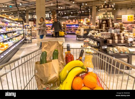 Grocery Cart In Supermarket Filled With Food Products Seen From The