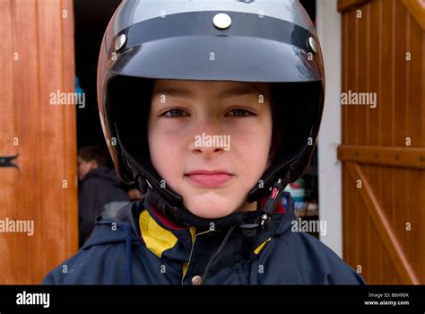 Young boy wearing motorcycle helmet Stock Photo - Alamy