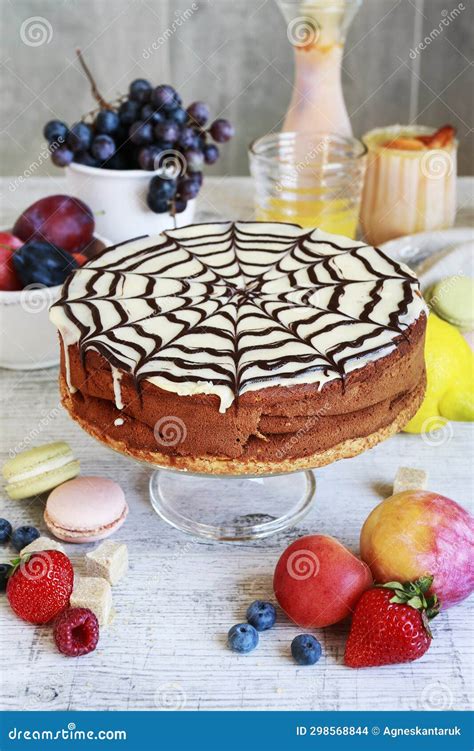 Halloween Chocolate Spider Web Cake And Various Fruits Around Stock