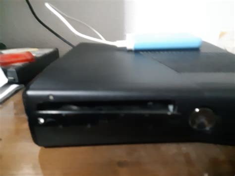 My disc tray is stuck like this. Can anyone help me? : r/xbox360