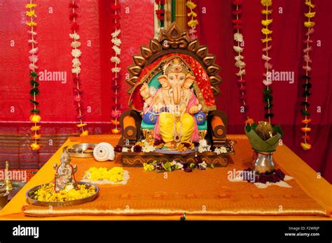 An Altar To The Hindu God Ganesha Or Ganesh Reading Hindu Temple Stock