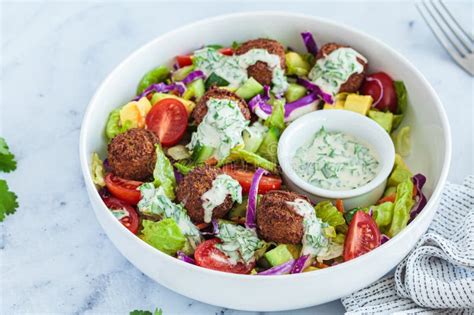 Falafel Salad With Avocado Tomato And Tahini Dressing Stock Photo