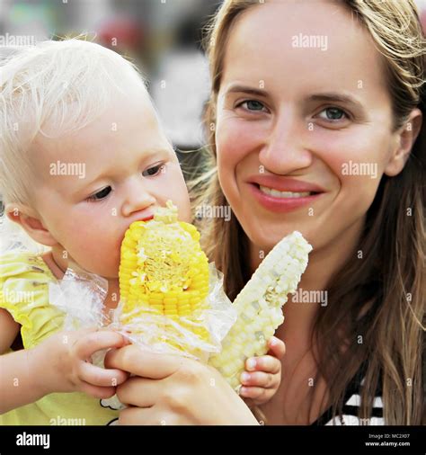 Woman Child Eating Corn Cob Hi Res Stock Photography And Images Alamy