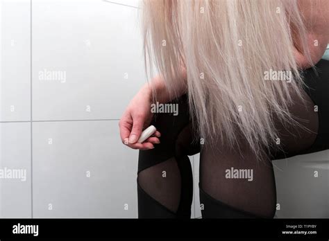 Woman sitting on the toilet hi-res stock photography and images - Alamy