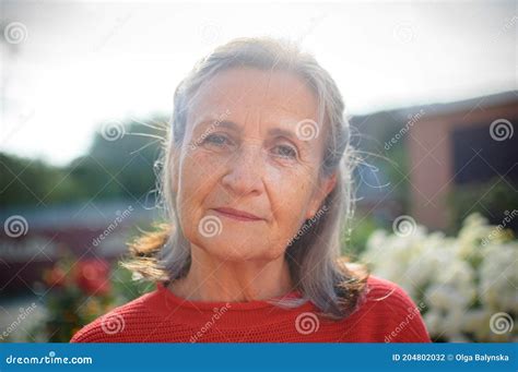 Beautiful Old Grandmother With Grey Hair And Face With Wrinkles