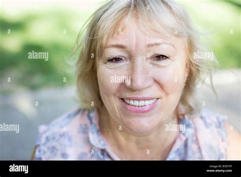 Portrait Of Happy Mature Woman Looking Up Outdoors Stock Photo Alamy