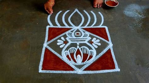 A Person Sitting On The Ground Drawing With Chalk