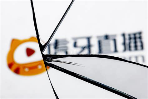 Logo of the Huya Live Streaming Service in the Reflection of a Broken ...