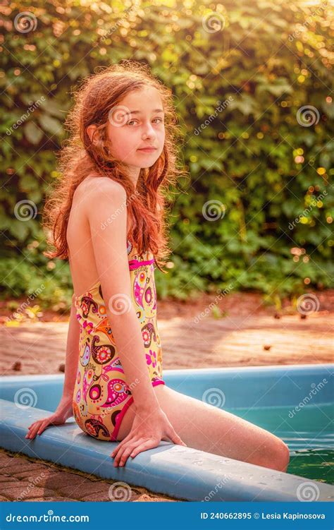 The Girl And The Pool A Teenager On Vacation In A Swimsuit Stock Image