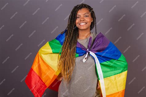 Premium Photo Young Afro Brazilian Woman Wearing Flag As A Cape Lgbt