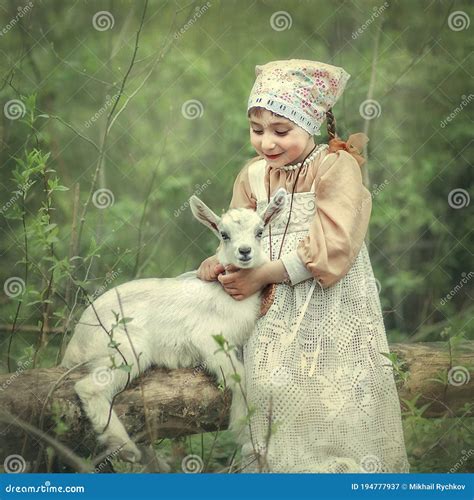 A Little Girl Hugs a Kid of Goat Stock Image - Image of portrait, natural: 194777937