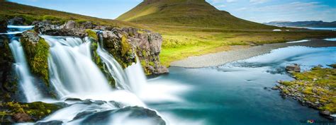 Kirkjufell mountain waterfalls with its mountains and magnificent ...